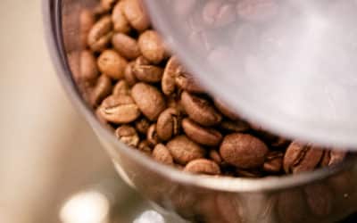 What are the advantages of buying whole bean coffee over ground coffee?